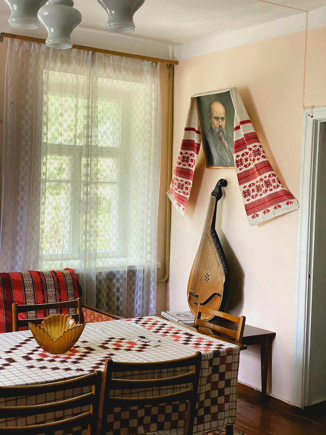 Stringed Musical Instrument on Brown Table · Free Stock Photo