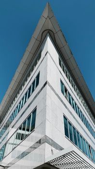 Low angle view of a modern building in Alkmaar, showcasing striking symmetry and design.