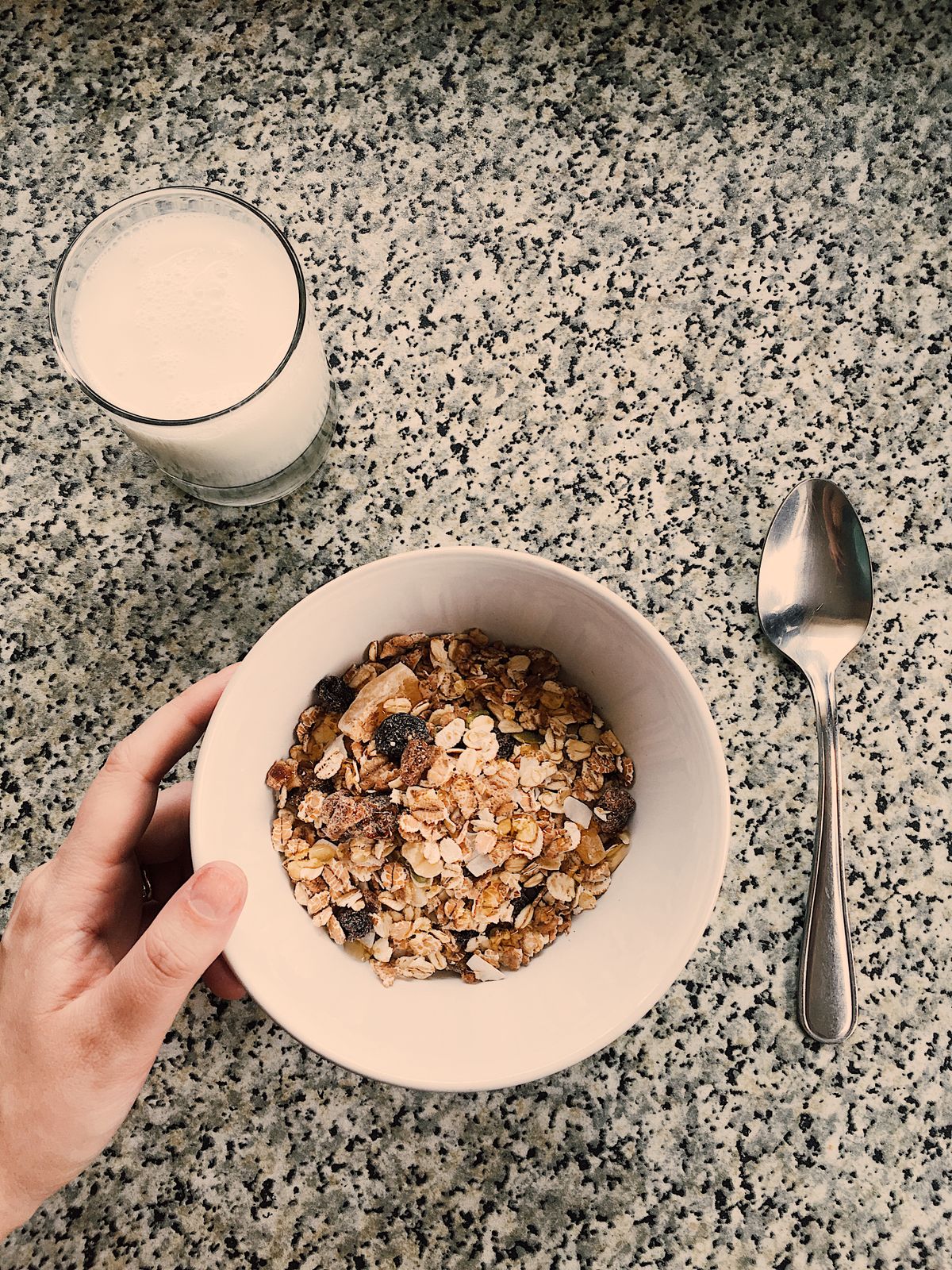 A breakfast bowl of oatmeal with milk on a kitchen counter for pantry organization ideas