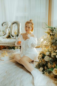 A charming indoor scene with a woman celebrating her 30th birthday amid elegant decor.