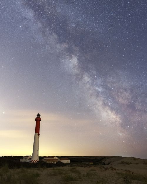 Free Stunning view of the Milky Way over Royan lighthouse at twilight. Stock Photo
