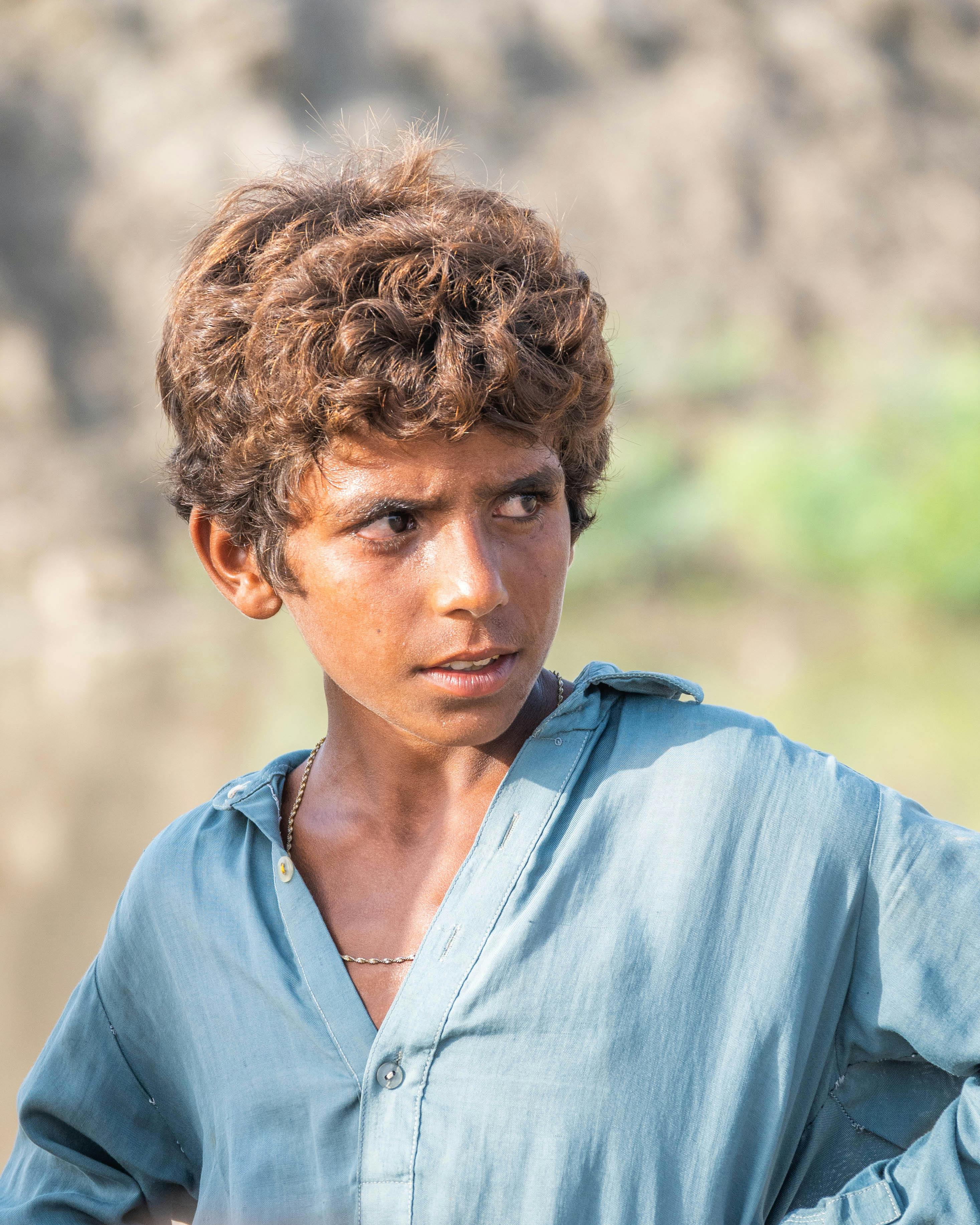 Portrait of Brunette Boy with Curly Hair · Free Stock Photo