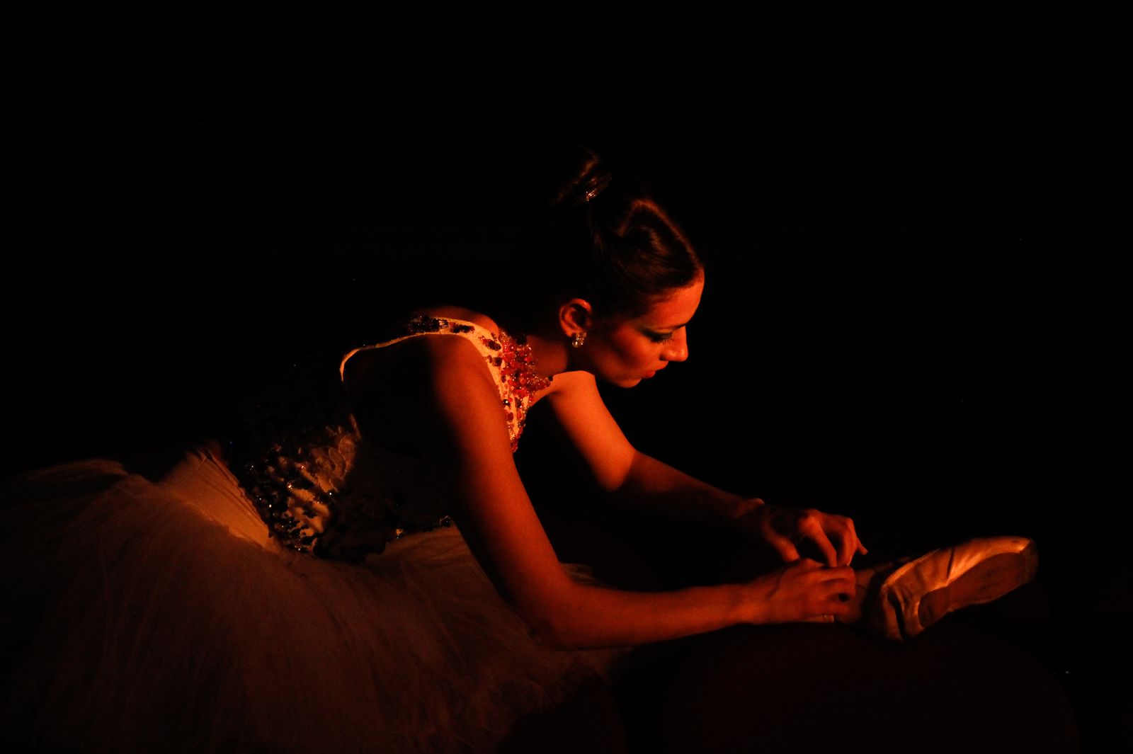 Dancer in warm red stage light