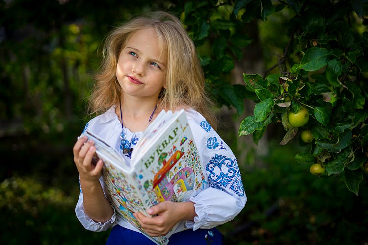 Girl Holding A Book