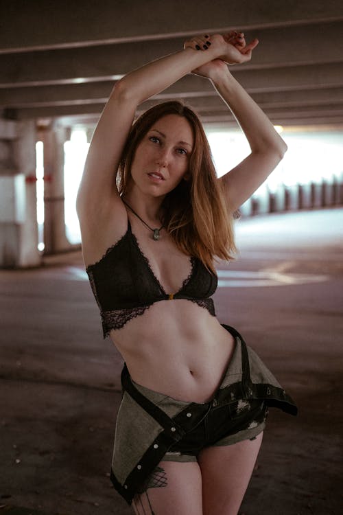 Free Woman Posing in Lingerie in an Underground Car Park  Stock Photo