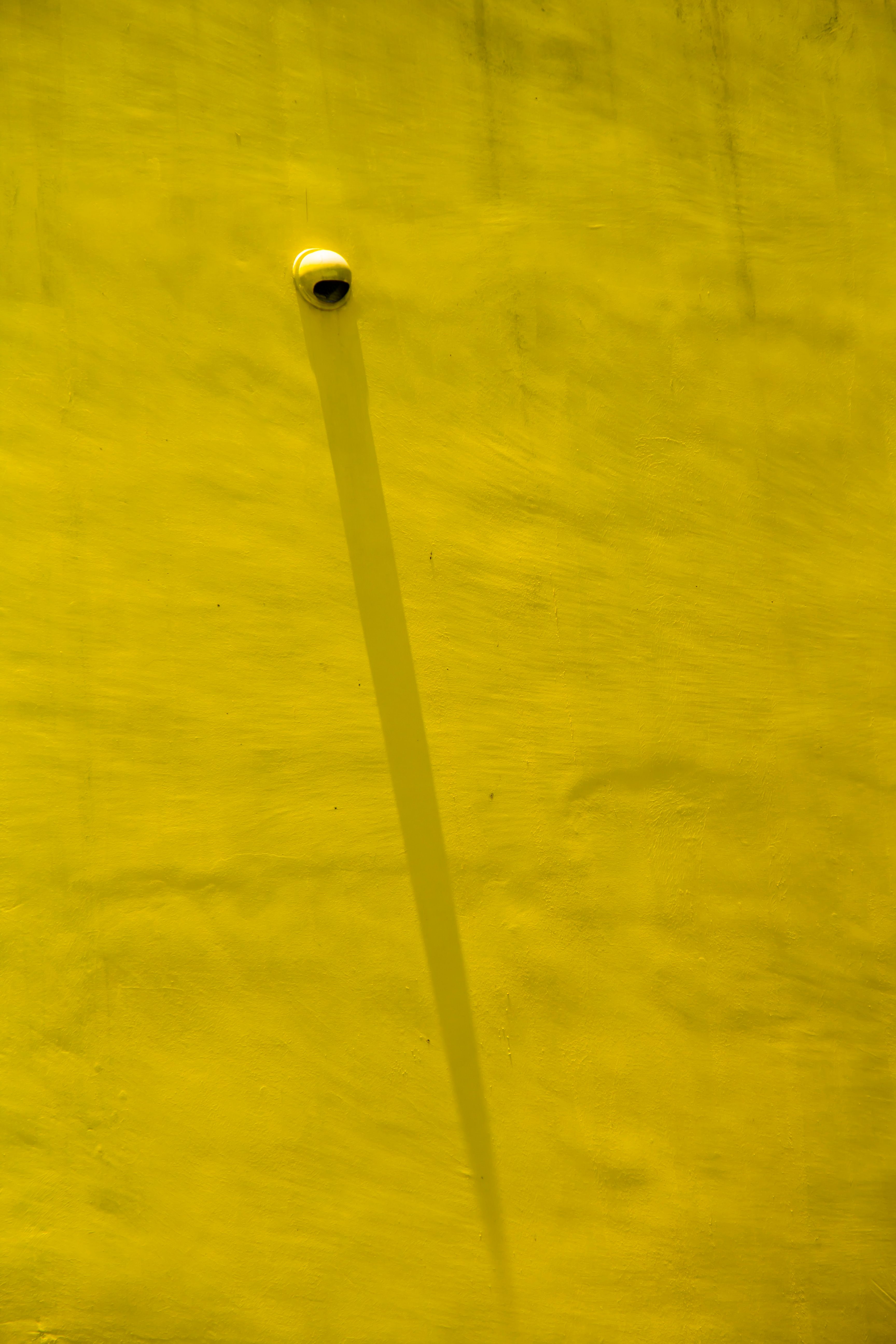 Shadow on a Yellow Wall · Free Stock Photo