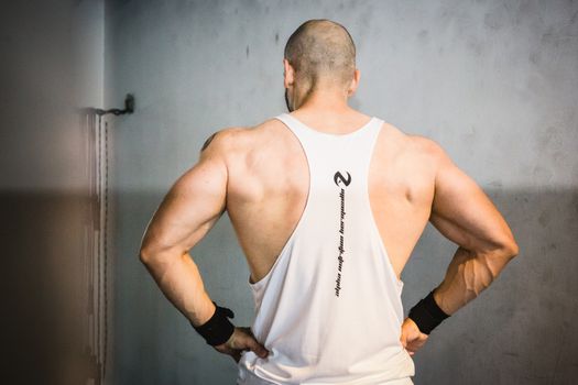 Backview of Brawny Man with Broad Shoudlers in White Tank Top 