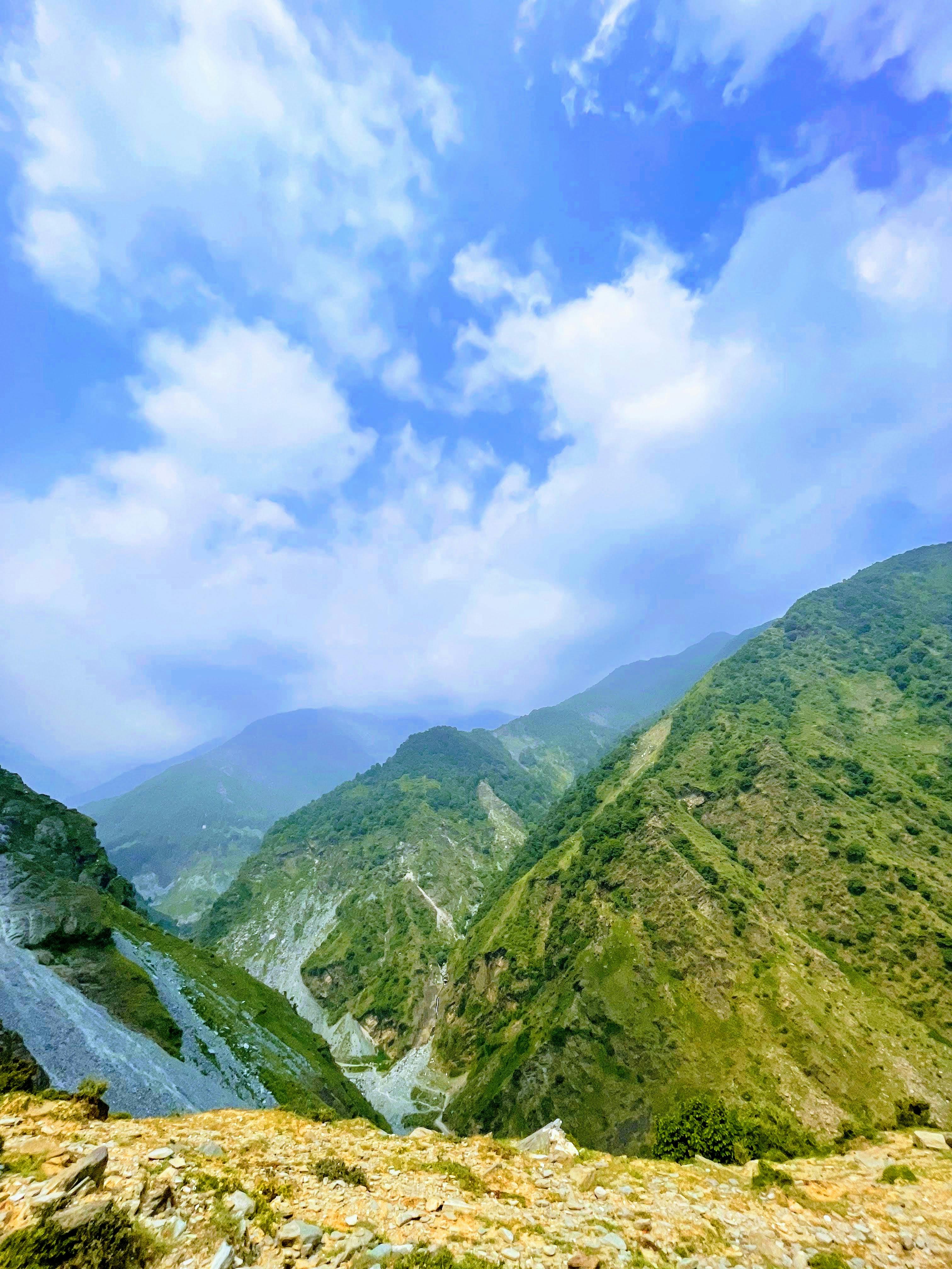 green mountains under the blue sky