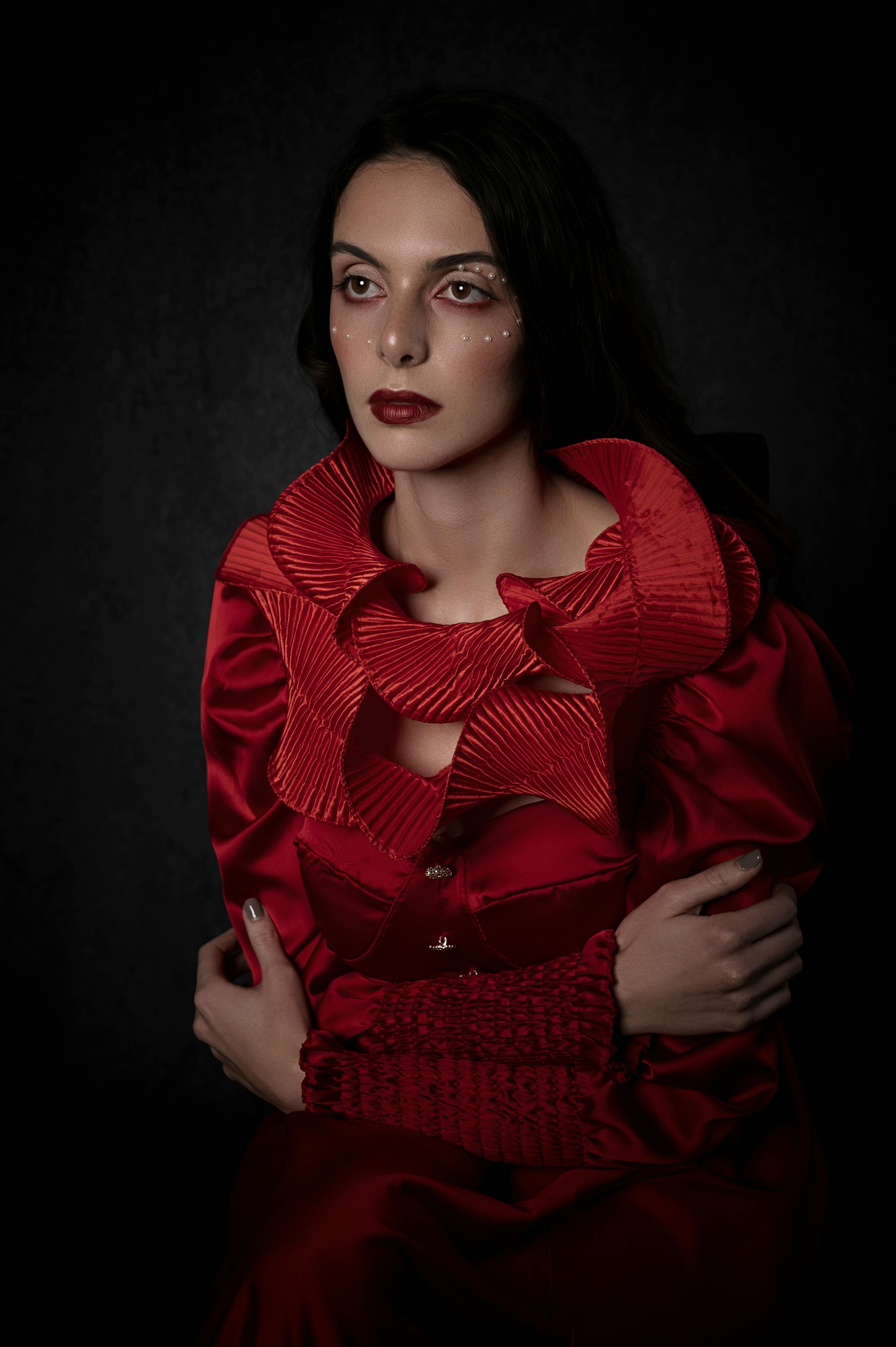 A Woman in Red Dress Posing at the Camera · Free Stock Photo