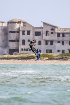 A thrilling kitesurfing jump near an abandoned building in Adicora, Venezuela.