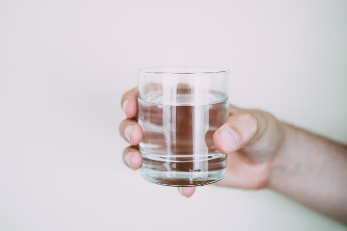 Free Person Holding Drinking Glass Stock Photo