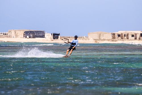 Free Experience the thrill of kitesurfing with vibrant waves and scenic views in Adicora, Venezuela. Stock Photo