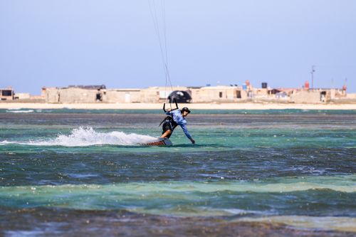 Free Exciting kitesurfing action captured in Adicora, Venezuela, showcasing skill and adventure. Stock Photo