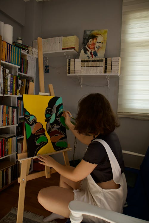 Woman Painting in Living Room