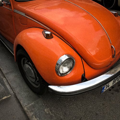 Parked Orange Volkswagen Beetle 