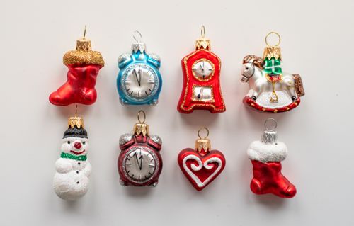 Free A variety of colorful Christmas ornaments displayed on a white surface, featuring holiday designs. Stock Photo