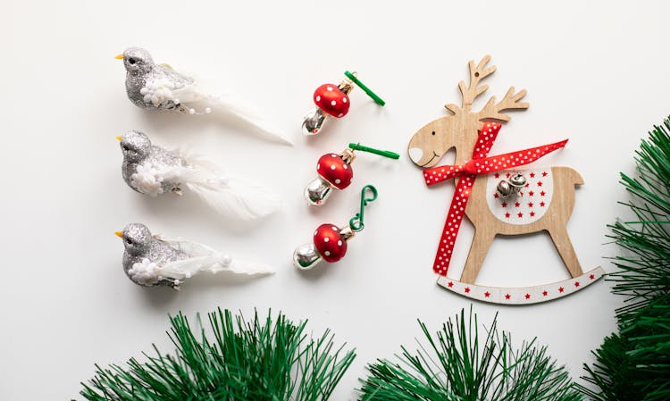 Assorted Christmas Ornaments On White Surface