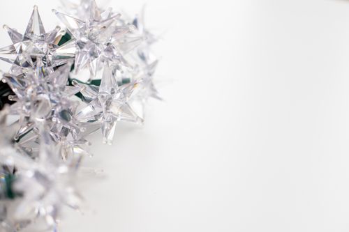 Free Close-up of crystal star decorations with ample white copy space. Stock Photo