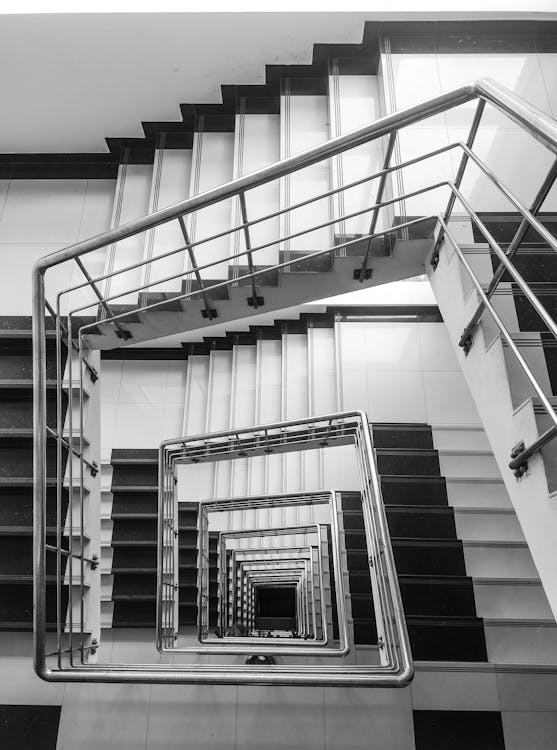 Grayscale Photo of a Stairwell 