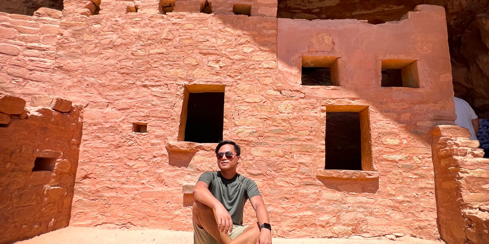 A traveler enjoying a moment at a historic cliff dwelling in Colorado - native american historic sites