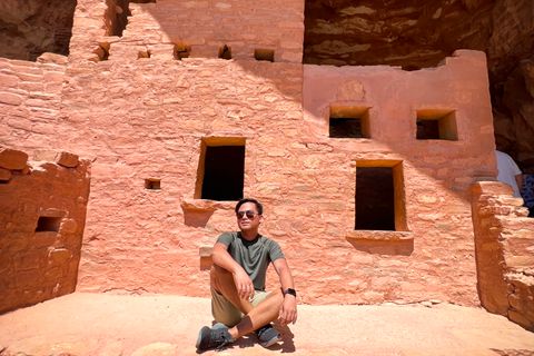 A traveler enjoying a moment at a historic cliff dwelling in Colorado - native american historic sites