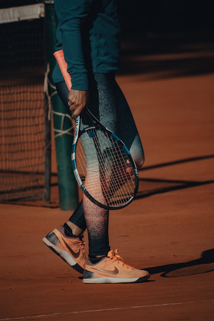 Close Up Of Person With Tennis Racket