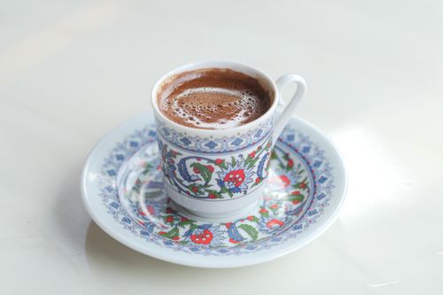Free Close-up of Turkish coffee in a decorative cup and saucer, showcasing intricate floral patterns. Stock Photo
