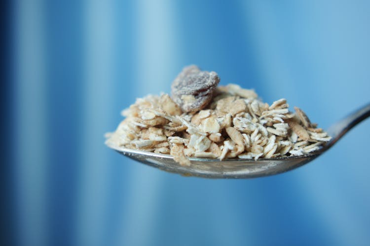 Brown Grains In Stainless Spoon