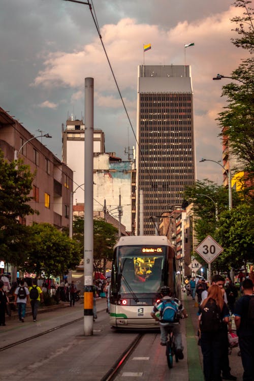 Coltejer Building behind Tram on Street in Medellin