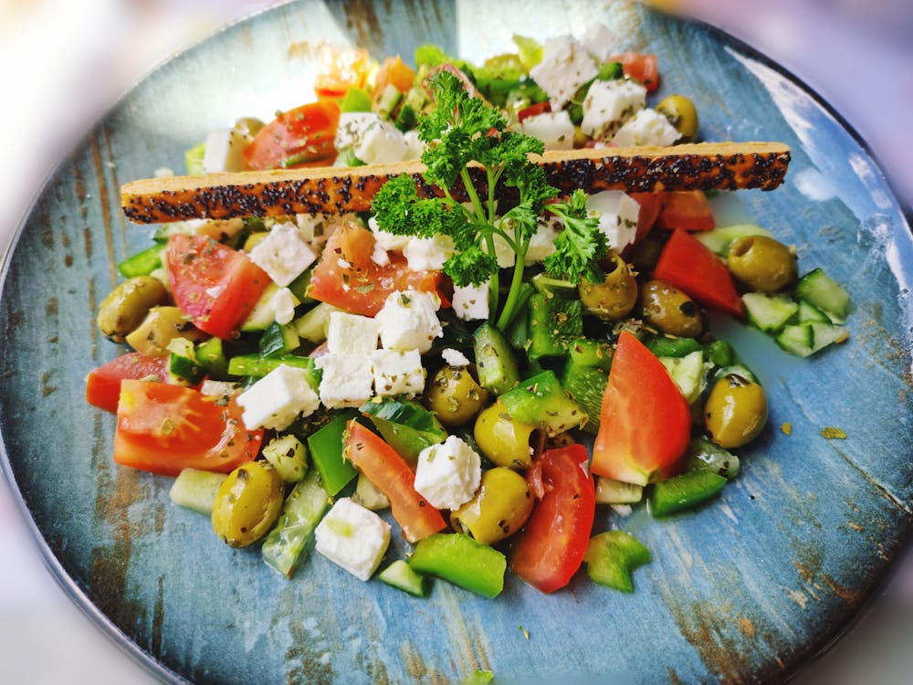 Free Vegetable Salad on Blue Ceramic Plate Stock Photo