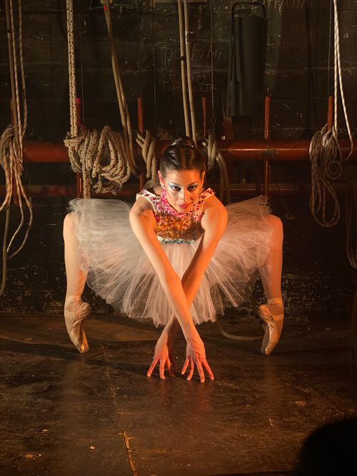 Free A ballerina in a striking pose backstage, showcasing the intensity of performance art. Stock Photo
