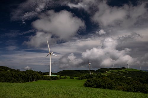 Wind Turbines under a Cloudy Sky