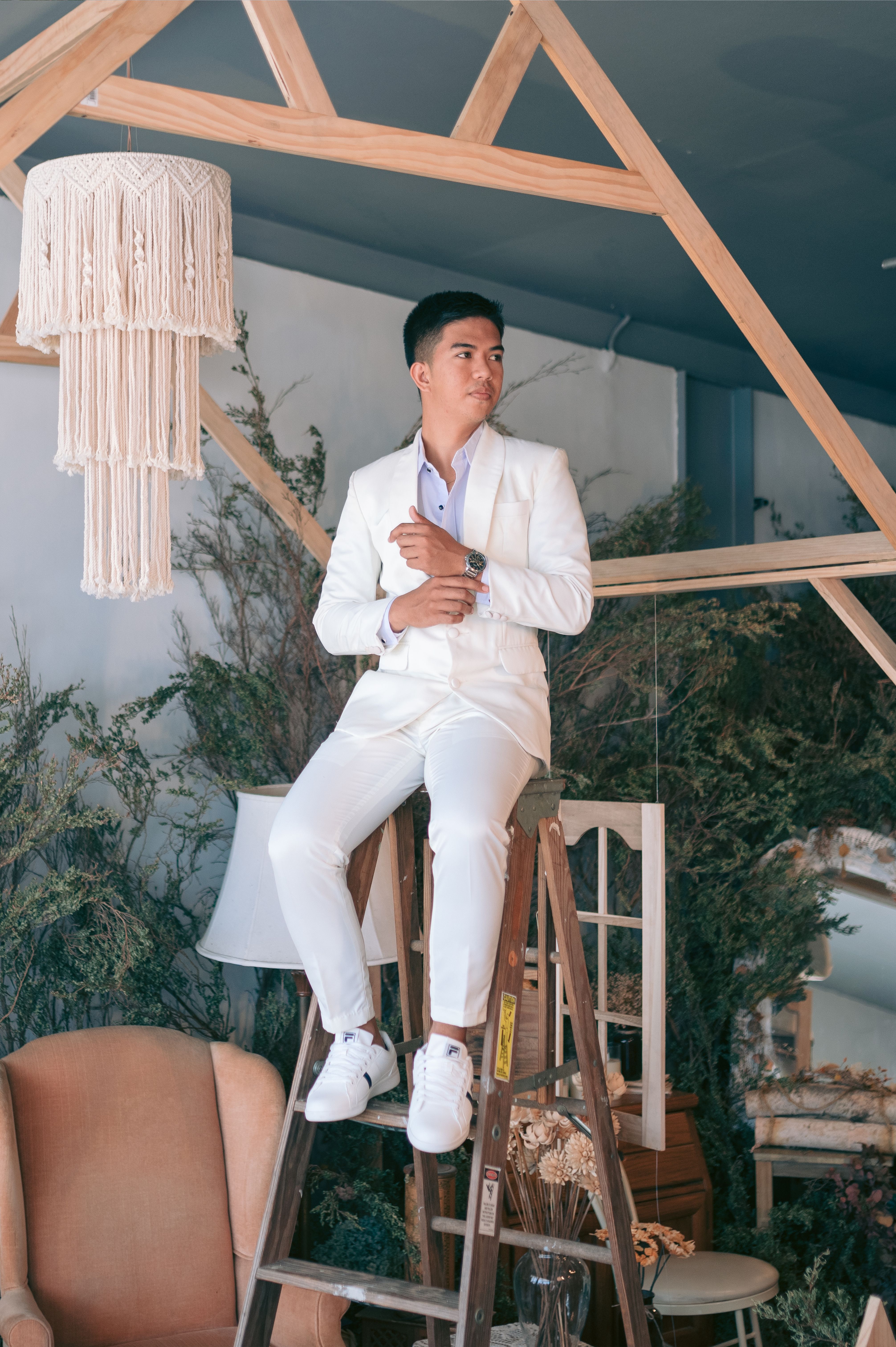 Man in White Suit on a Ladder · Free Stock Photo