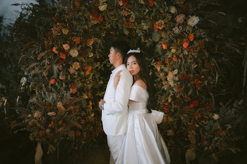 Photo of a Bride Hugging a Groom