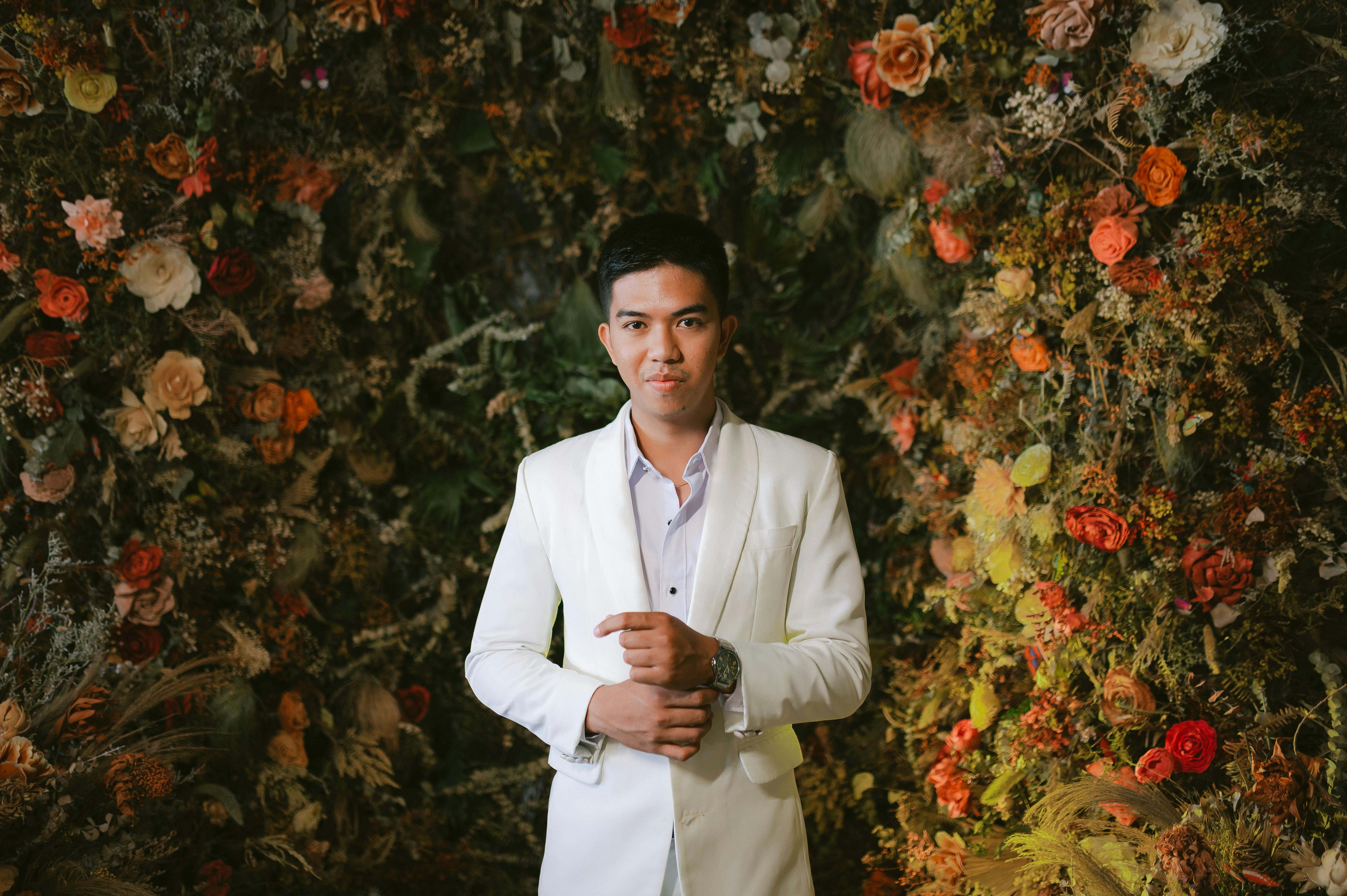 Man in Wedding Suit among Flowers · Free Stock Photo