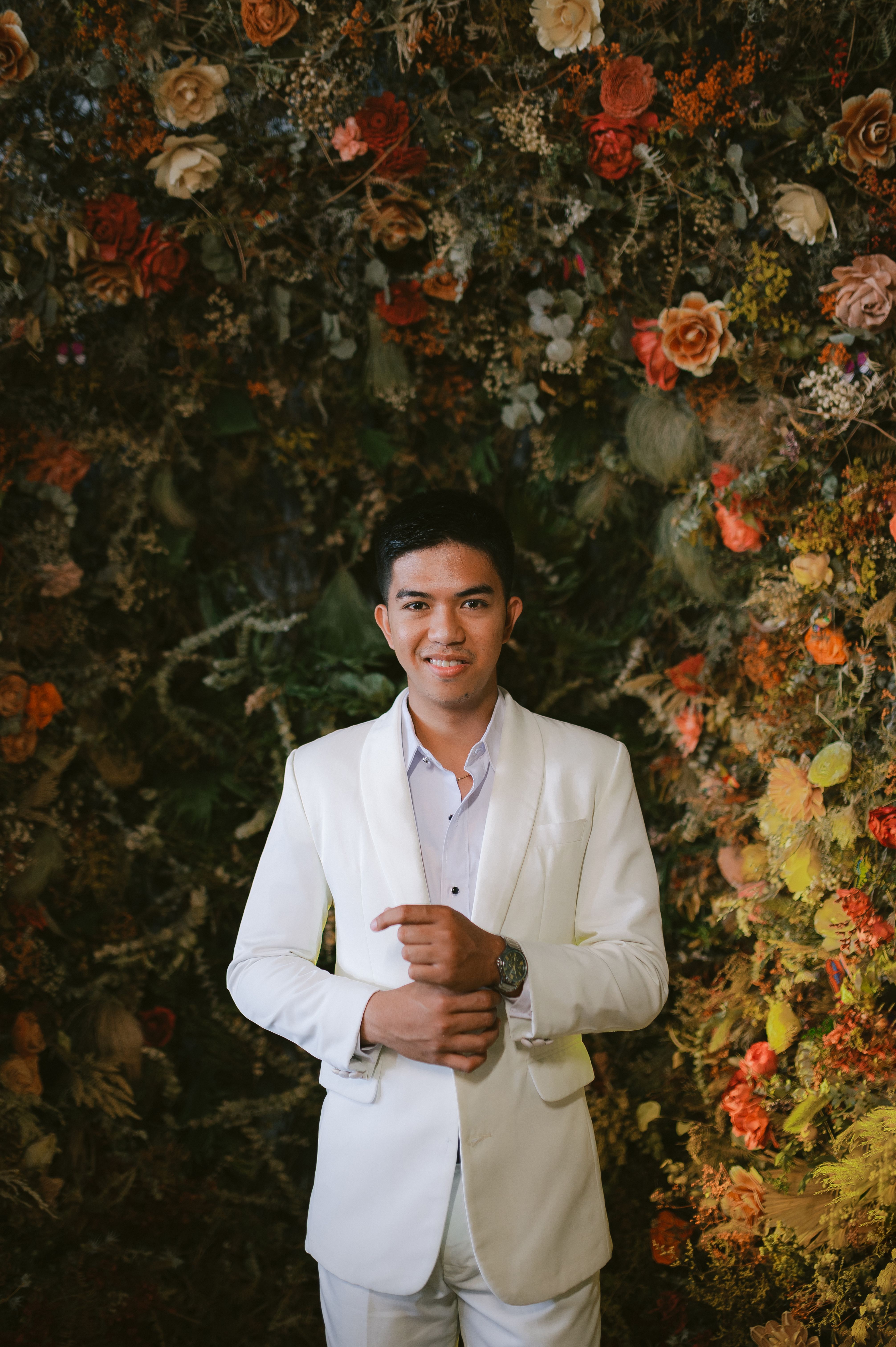 Man in White Suit Posing in a Garden · Free Stock Photo