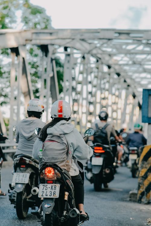Free Group of people riding motorcycles on a bridge, highlighting daily commute. Stock Photo