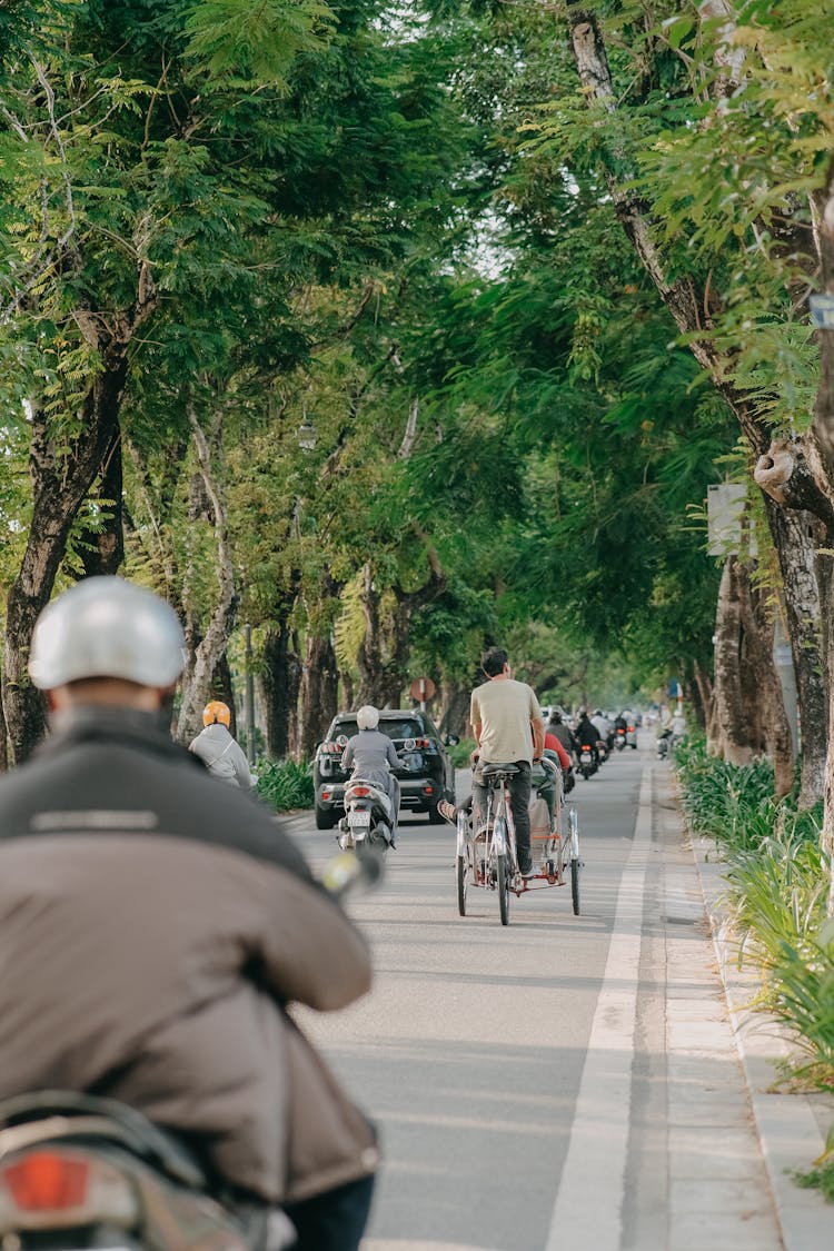 People Riding Motorbikes On Street