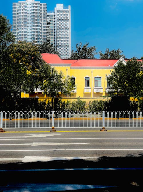 Yellow Building beside Green Trees