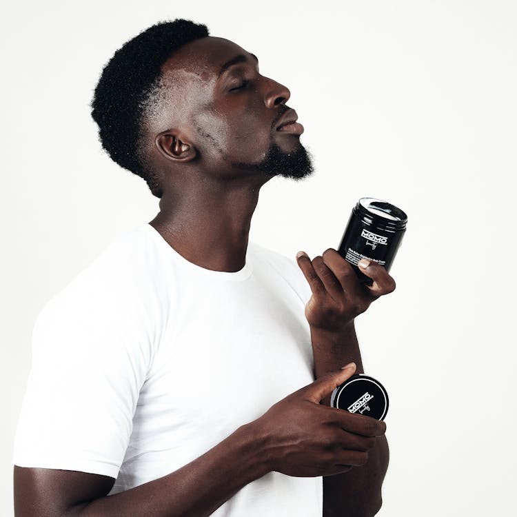 A Male Model Holding A Body Care Product