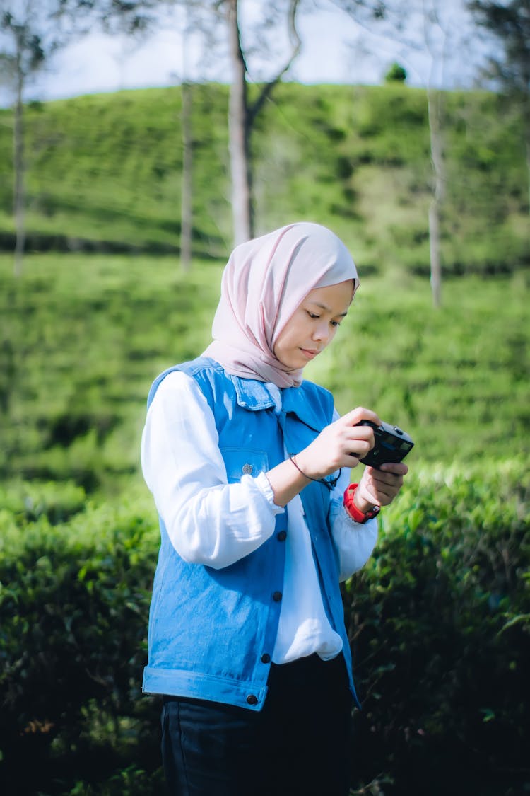 Woman Holding A Camera