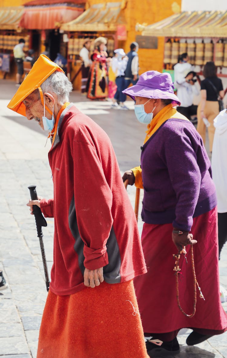 Elderly Women With Masks On A Square 