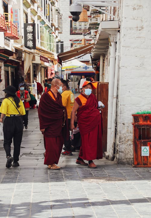 Buddhist Monks Walking in Town