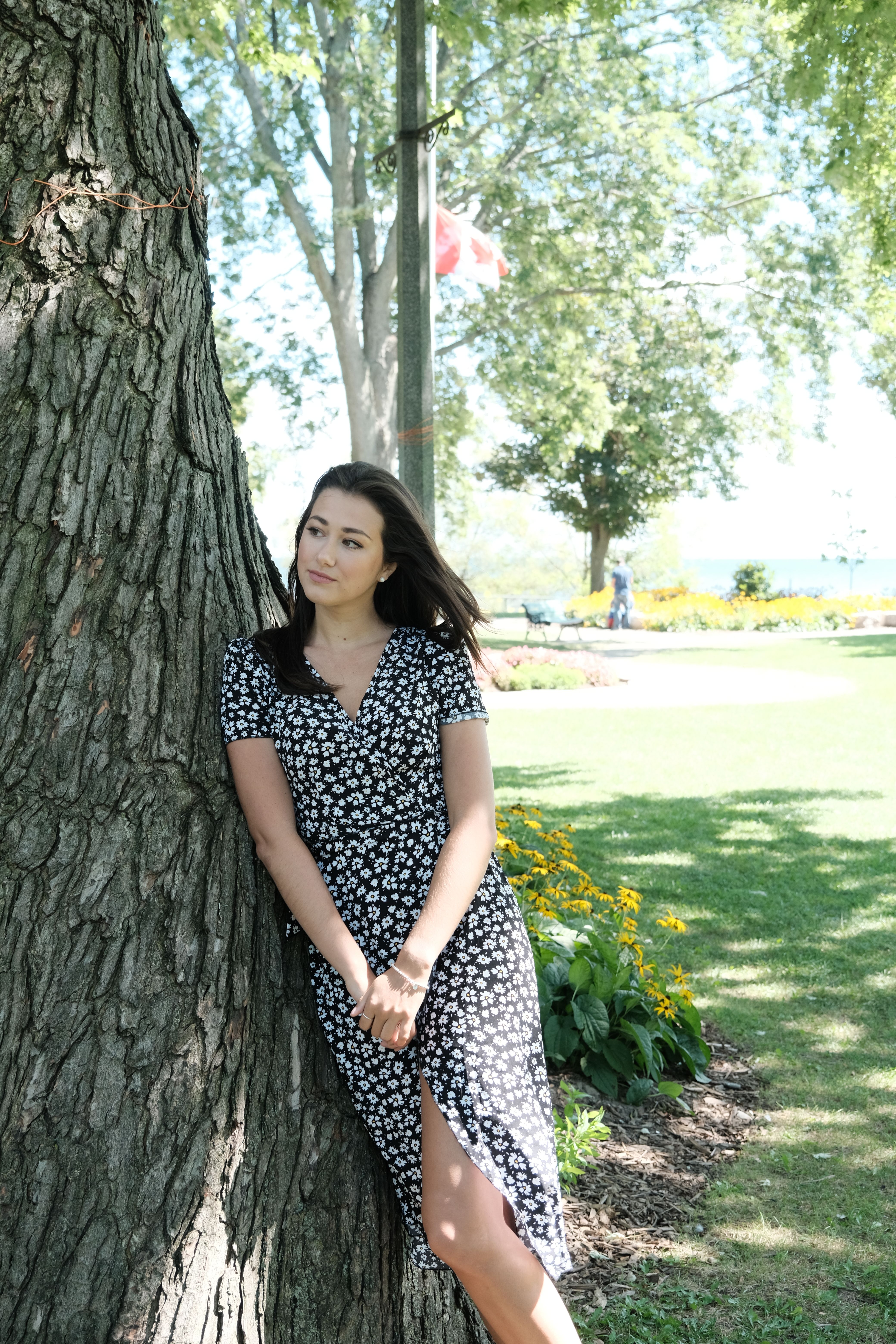 A Woman Standing Beside the Tree · Free Stock Photo