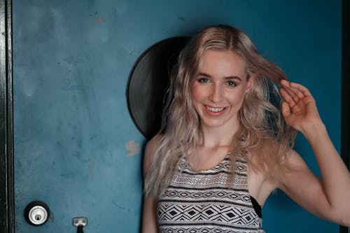 Woman in Black and White Tank Top Smiling