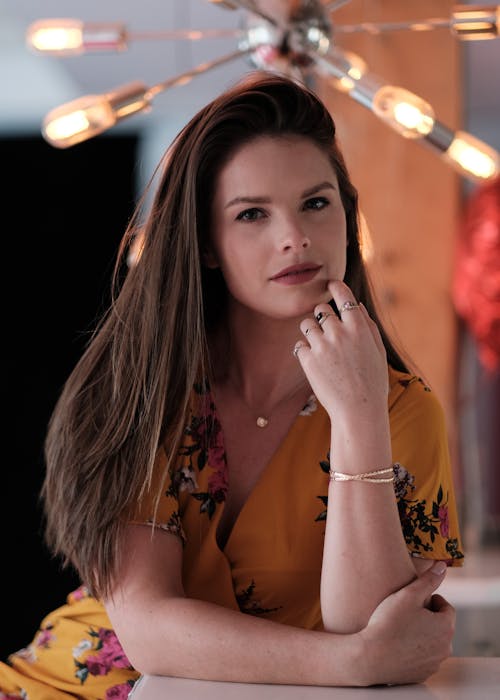 A Woman Posing in Yellow Dress