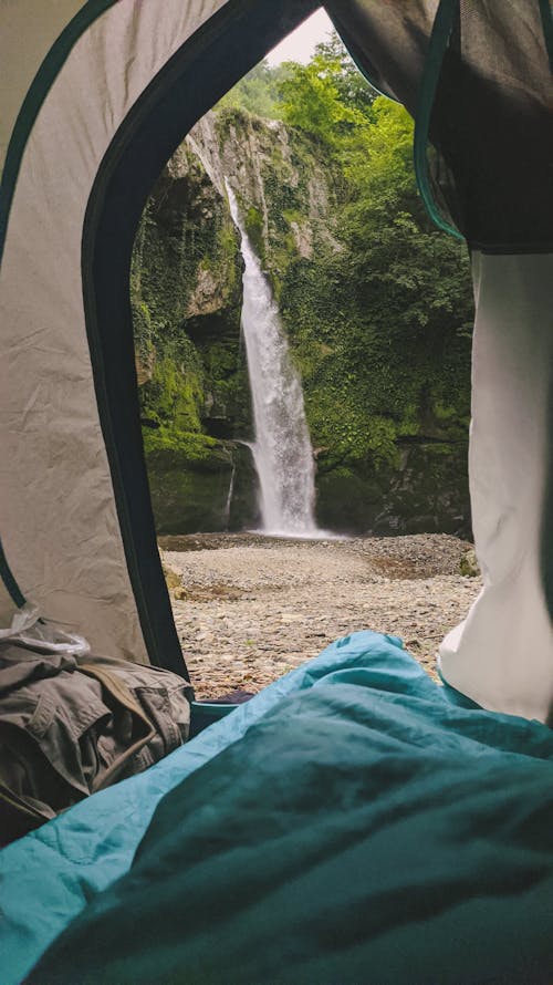 View of flowing Waterfalls from a Tent 