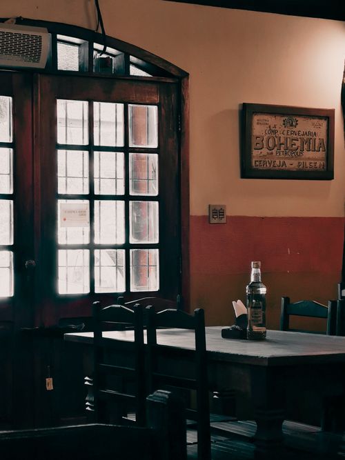 Free A cozy restaurant interior in Brazil featuring wooden furniture and vintage decor. Stock Photo