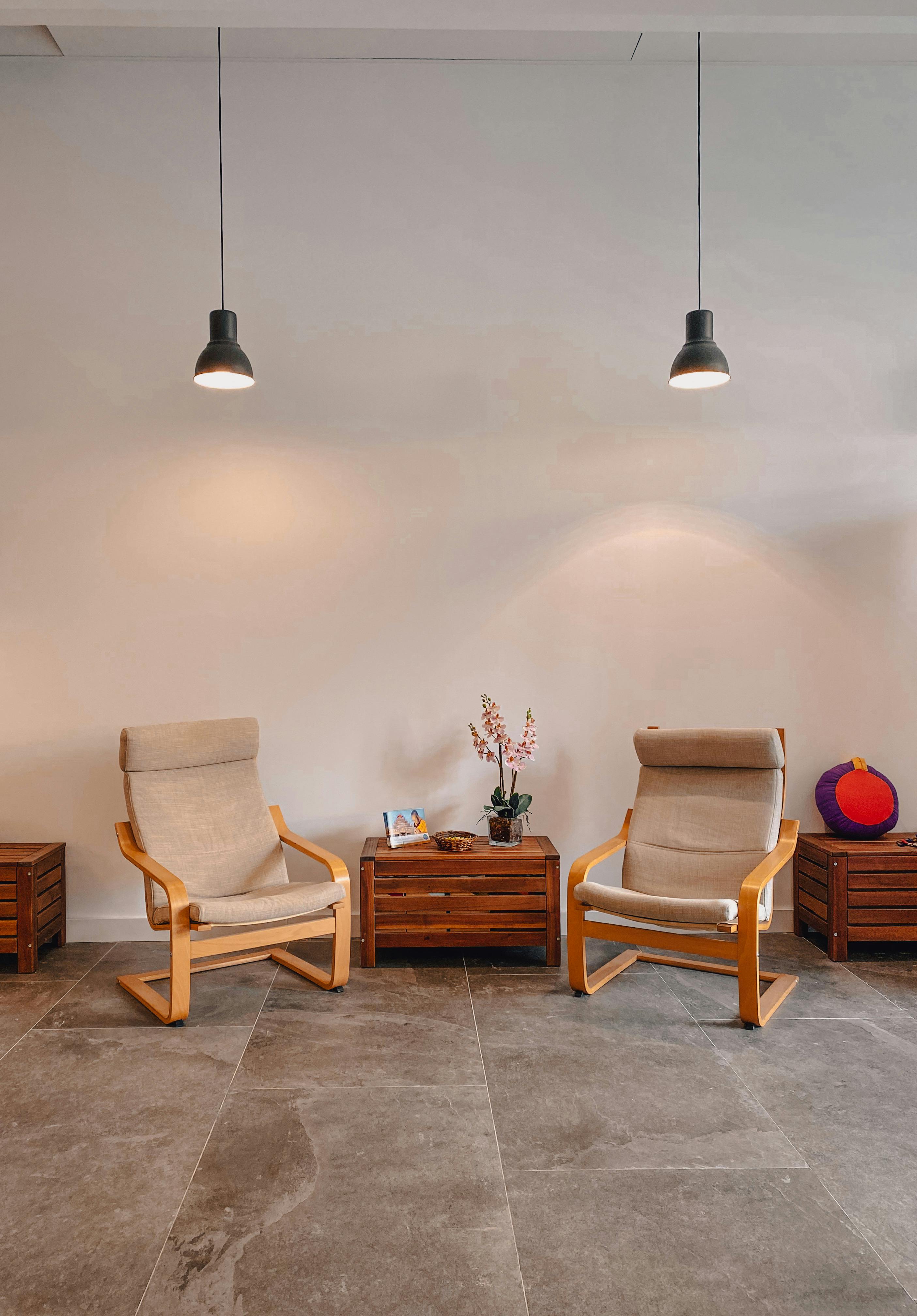 brown wooden armchair beside brown wooden table