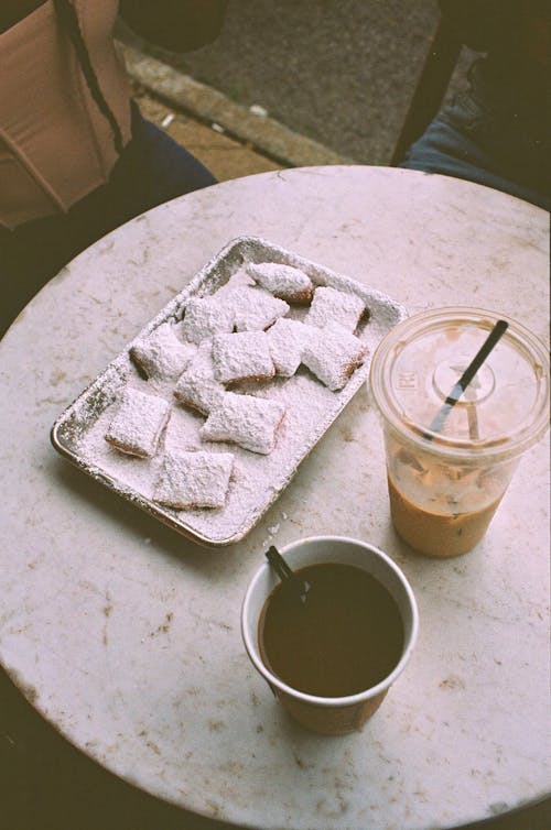 Coffee Drinks beside a Plate of Pastries 